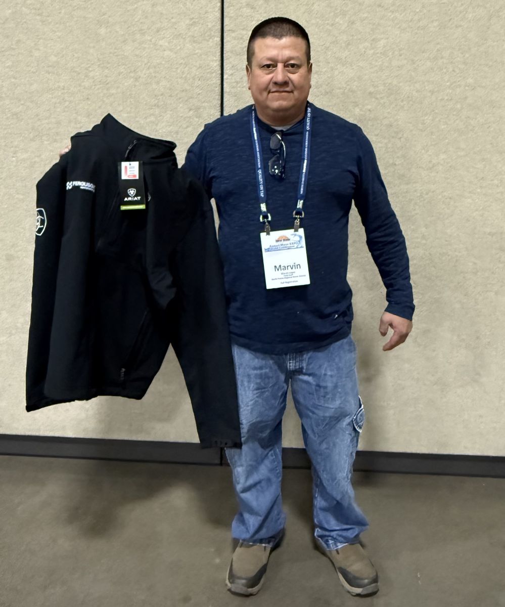 Marvin Lopez winning meter change out competition at the 39th NDRWSA Annual Expo